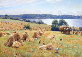 View from Tulstrup at lake Knudsø. The crops are brought in from the fields on a sunny day 1932