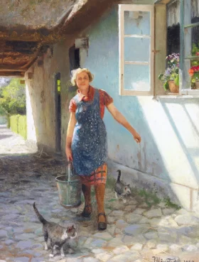 A woman and some cats in a farmyard at Strøby 1939
