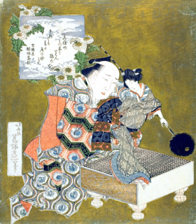 Puppeteer holding puppet on “go” board