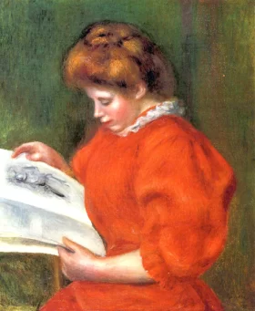 Young Woman Looking at a Print by Pierre Auguste Renoir Young Woman Looking at a Print by Pierre Auguste Renoir
